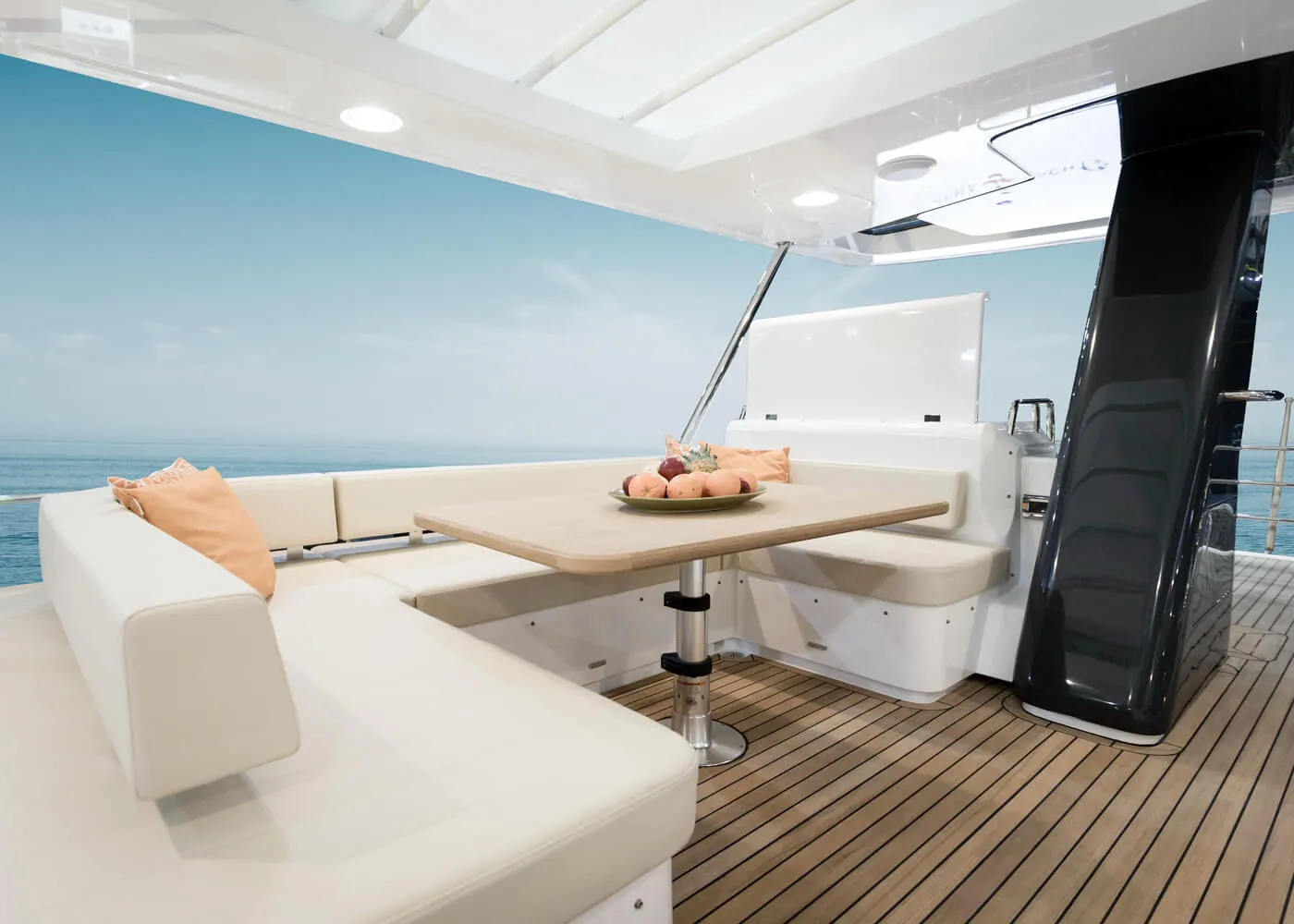 Shaded flybridge dining area with sea views